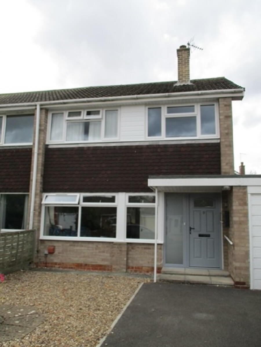 Elephant Grey front door with contrasting white casement windows