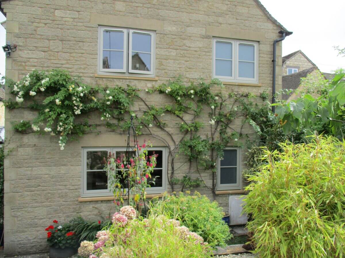 Pebble Grey flush sash PVCu windows with astragal bar