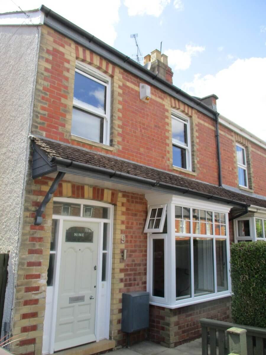 White sliding sash and casement bay window